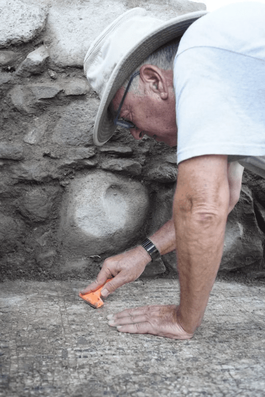 Professor Mordechai Aviam cleaning 1,500 years off the basillica