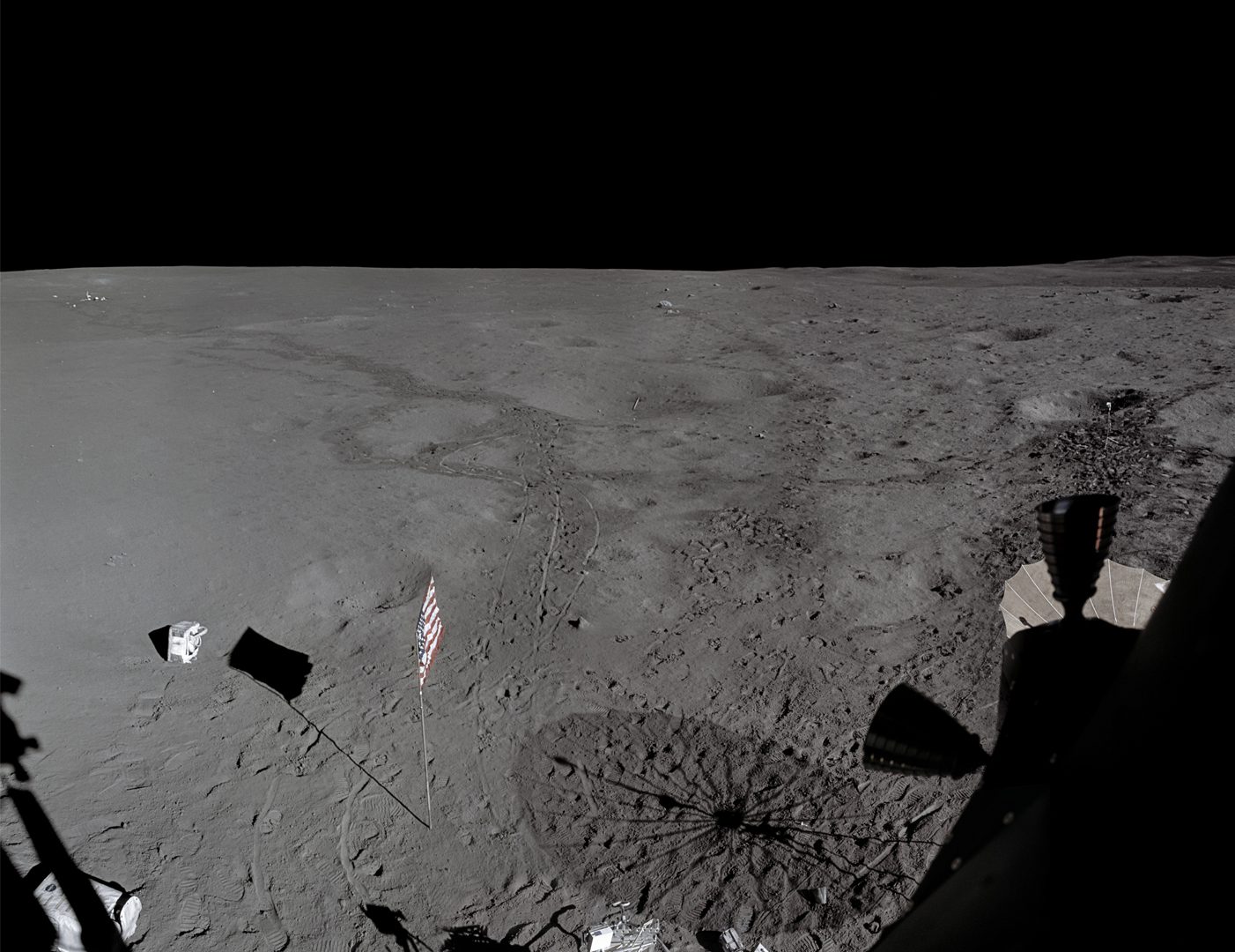 Surface of the Moon showing an American flag andeven gold balls, taken in 1971