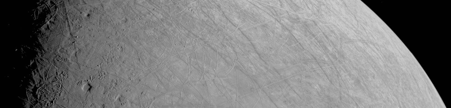 The scarred surface of Jupiter's moon europa which is due to ice causing cracks ans schisms 