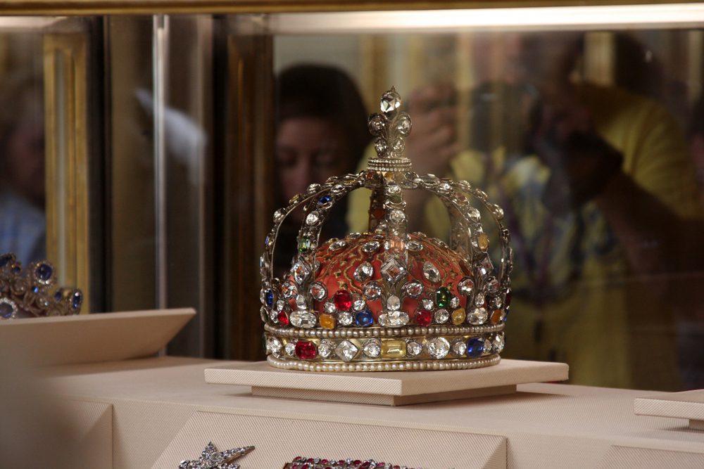 A heavily decorated crown in a museum cabinet that's part of British Crown Jewels on display at the Tower of London. 