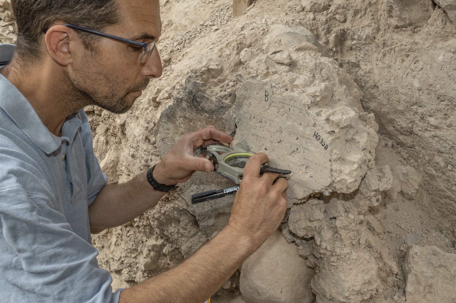 Yoav Vaknin measuring at the site of one of the destroyed cities, whose date of destruction has been provided by the magnetization encoded there. Image Credit: Shai Halevi, Israel Antiquities Authority