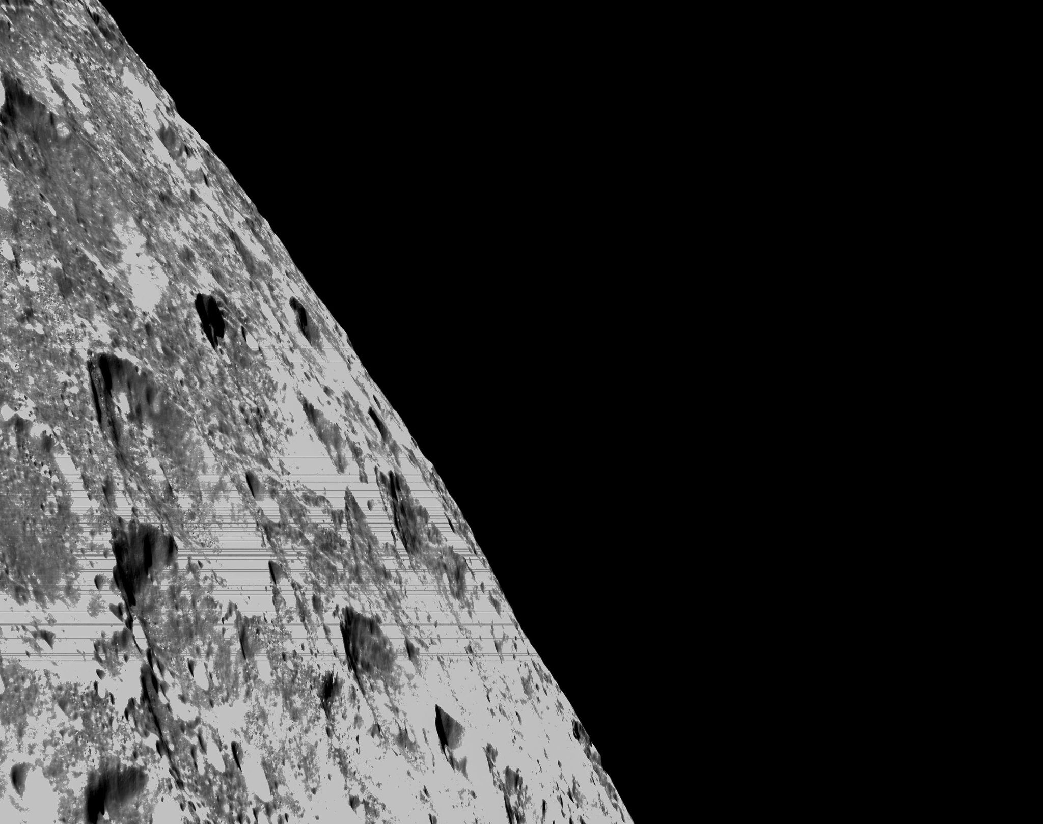 On the left hand side of the pictures the edge of the moon is visible with some deep craters clearly seen at an angle