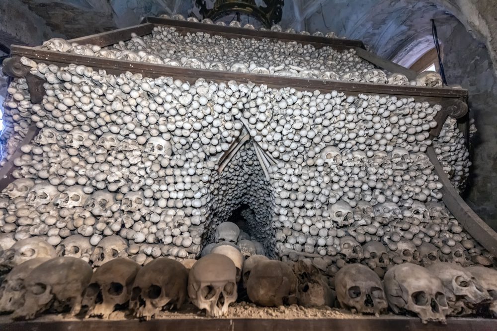 Stacks of bones and skull at an ossuary in Czechia.