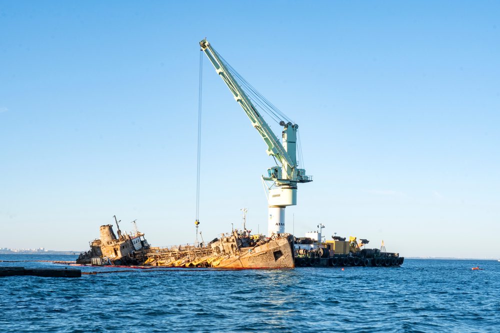 lifting a shipwreck with industrial crane
