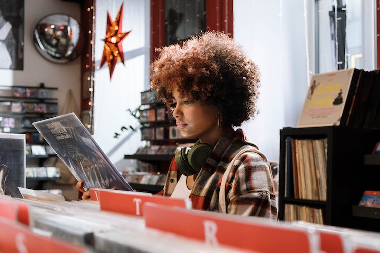 Woman in record store.