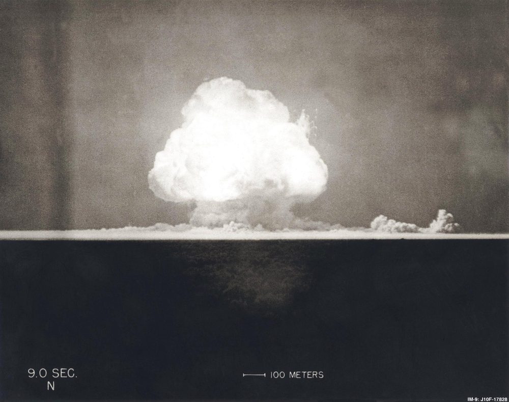 Black and white Photograph taken at 9 seconds after the initial Trinity detonation shows the Mushroom cloud in New Mexico. I