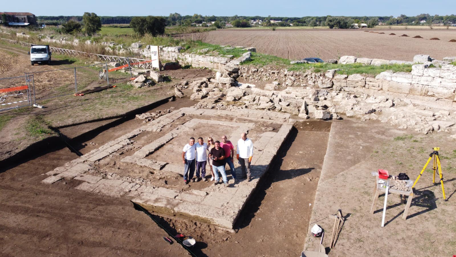 Archeoloigsts working at an ancient Neptune temple in ancient greek city 