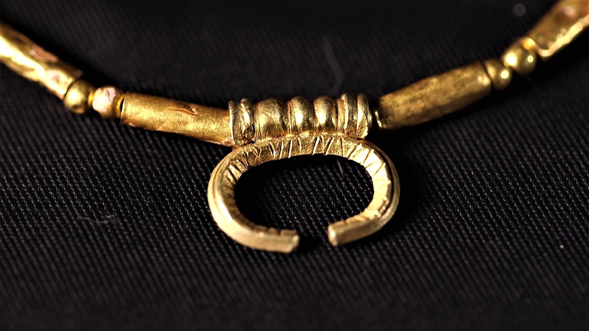 Golden jeweler in Israel with A lunula pendant, named after Luna, the Roman moon goddess.