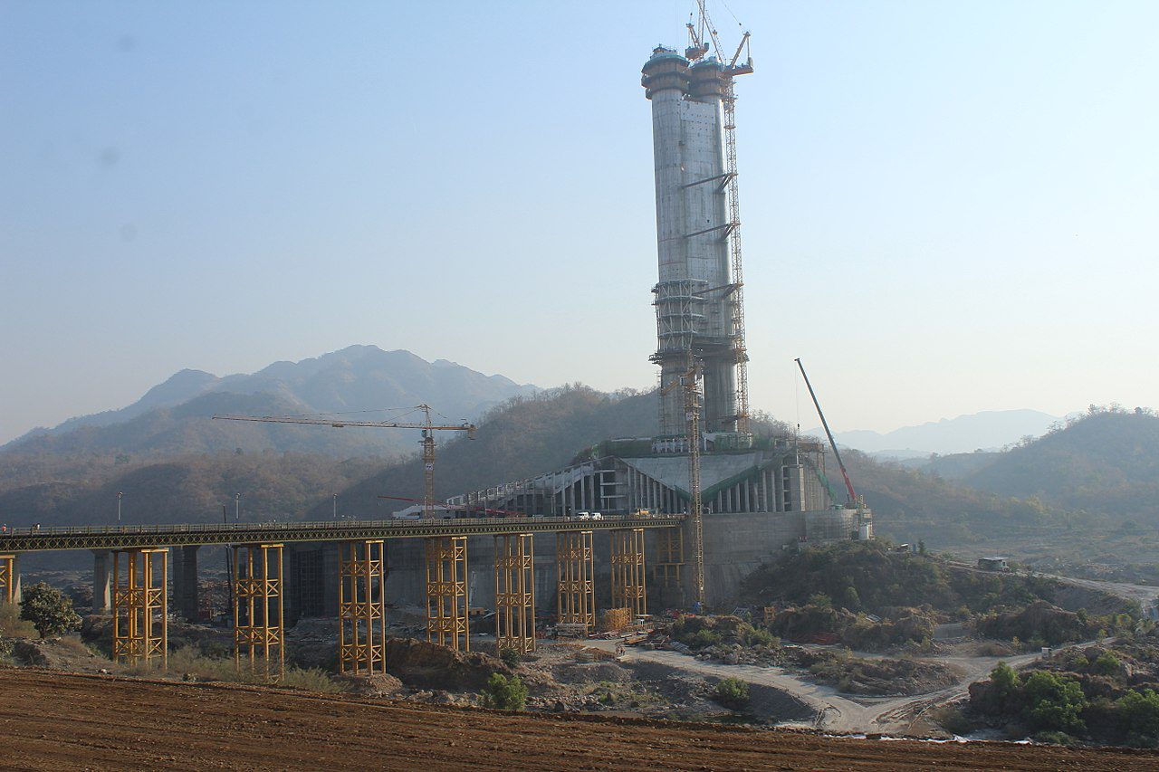 India's Statue of Unity under construction in January 2018 showing cranes and metal scaffolding.