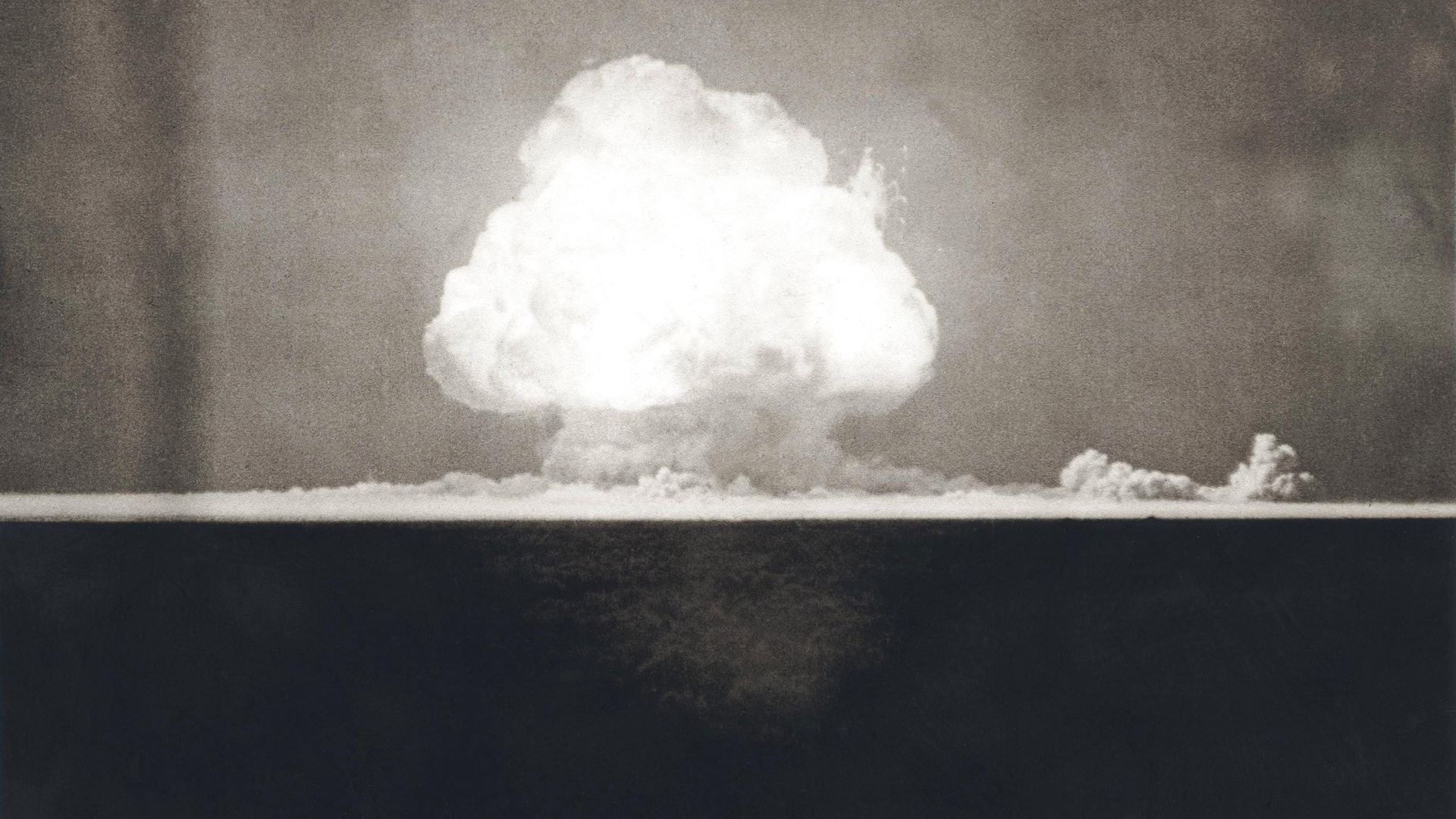First Atomic Explosion on July 16, 1945. Photograph taken at 9 seconds after the initial Trinity detonation shows the Mushroom cloud. Manhattan Project, World War 2. Alamogordo, New Mexico.