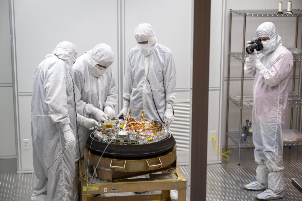 Curation teams process the sample return capsule from NASA’s OSIRIS-REx mission in a cleanroom, Sunday, Sept. 24, 2023, at the Department of Defense's Utah Test and Training Range. The sample was collected from the asteroid Bennu in October 2020 by NASA’s OSIRIS-REx spacecraft. 
