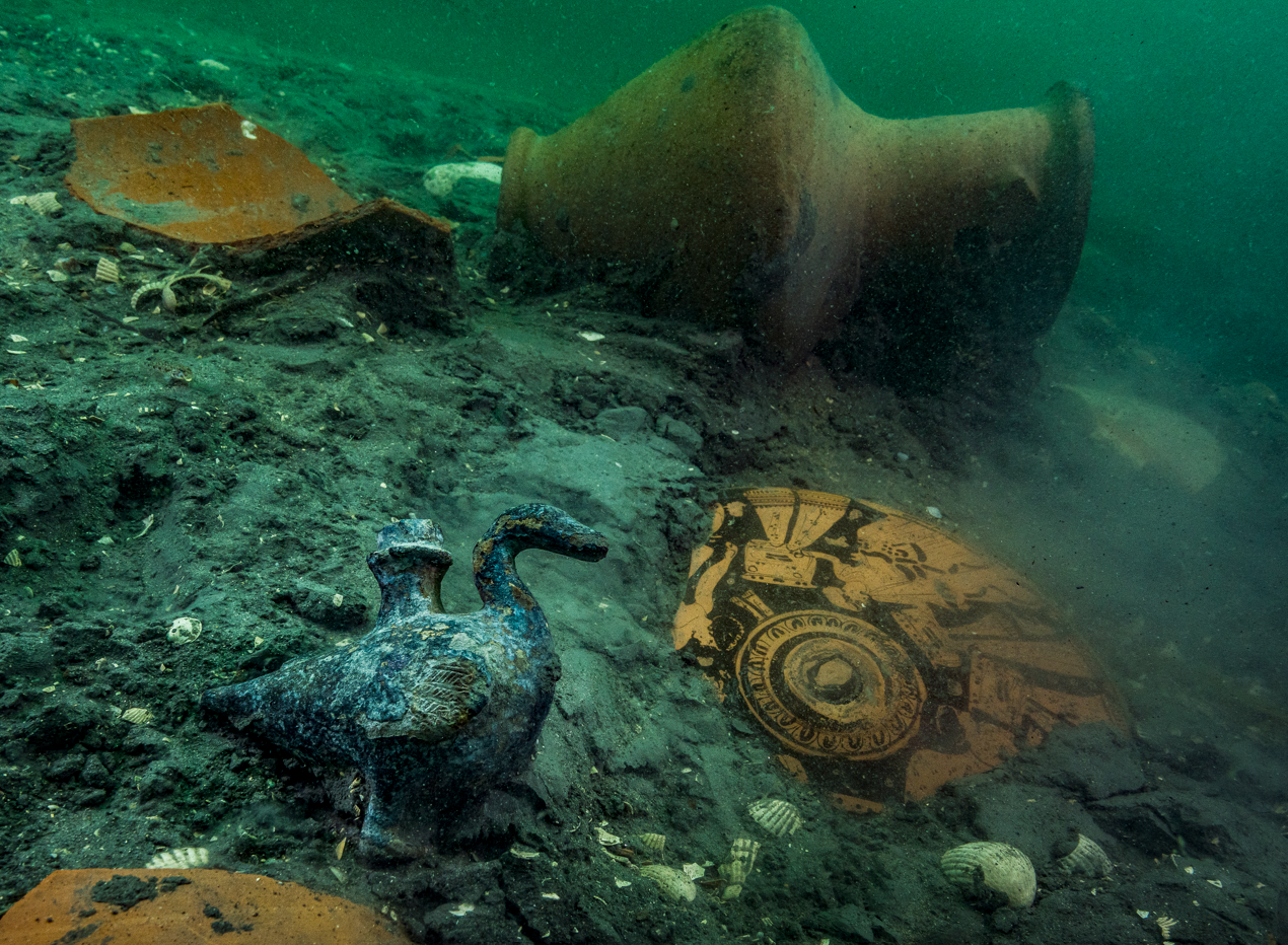 A delicate bronze duck-shaped pourer is discovered amongst ceramics of the 4th century BC on the site of a newly discovered Greek sanctuary to Aphrodite in Thonis-Heracleion.