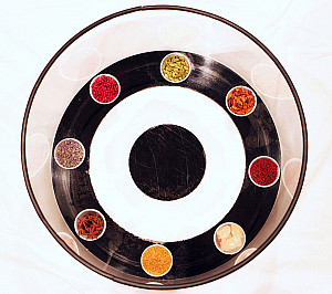 maze formed of concentric circles with jars of spices even spaced around the outer ring