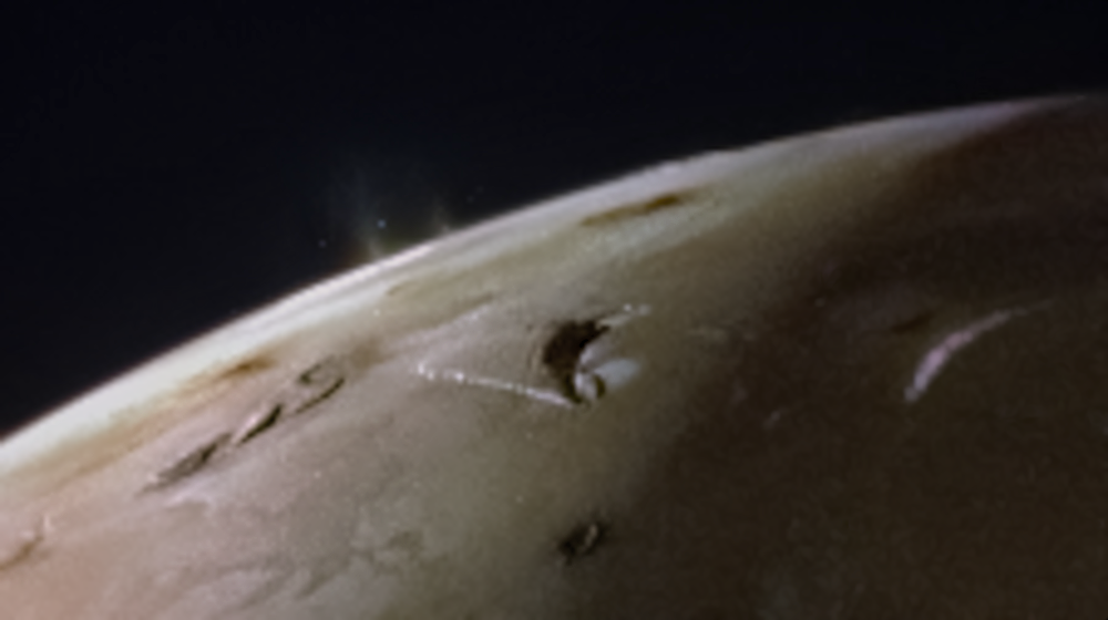 two plumes are visible at the limb of io.