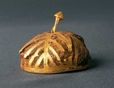 The gold covering makes this item look a little like the rest of the treasure, but when it was made the iron peaking through might have been more valuable.