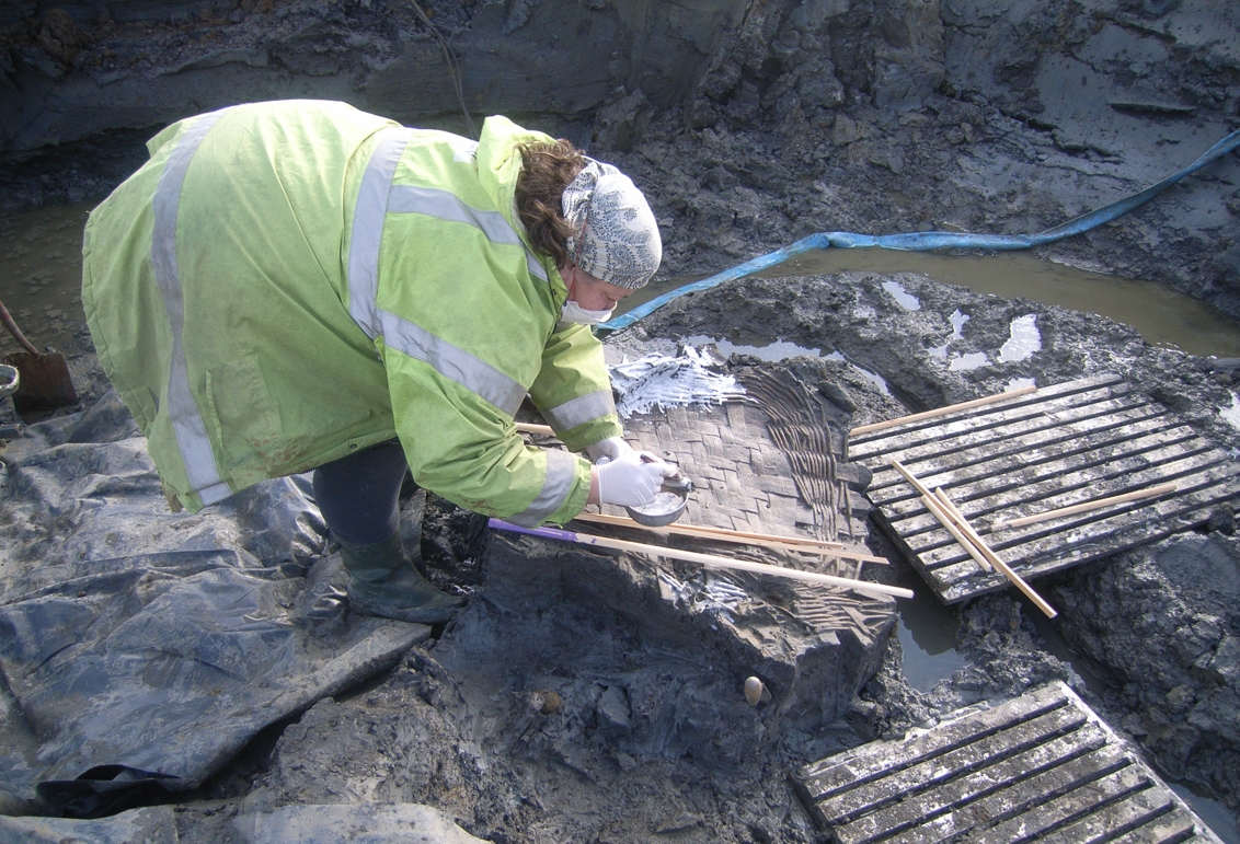 An archeologist at the site near Aylesbury unearths a 1,700 year old Roman egg.