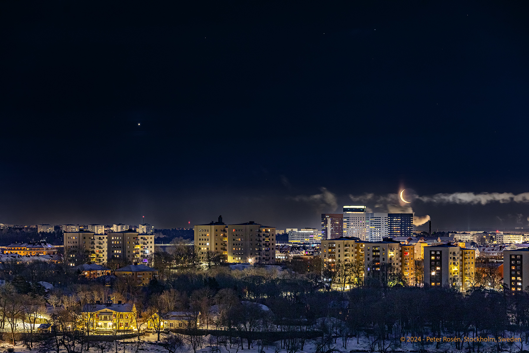 a cityscape of stockholm as captured by Rosen. The moon and venus are visible in the sky