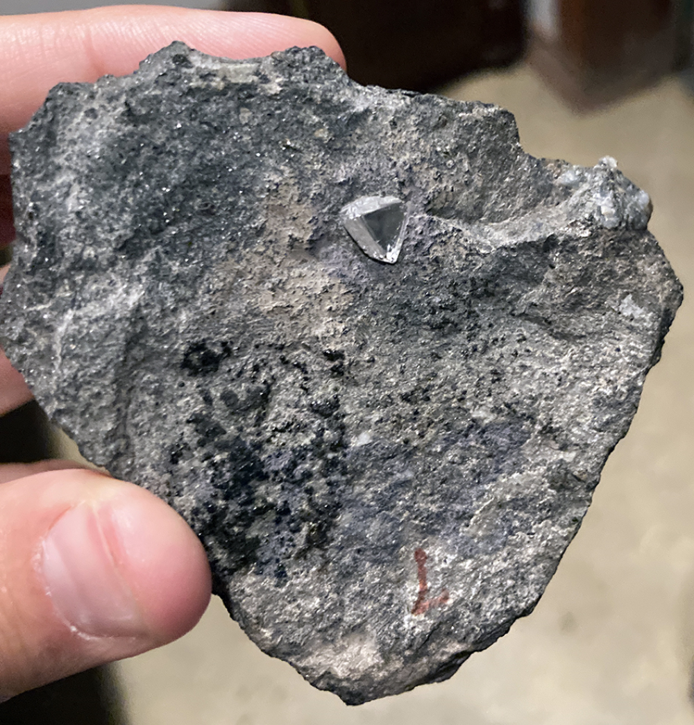 A diamond sticking out of kimberlite