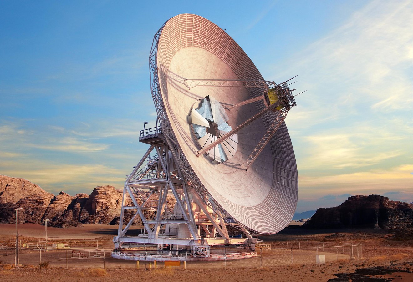 This artist's concept shows what Deep Space Station-23, a new antenna dish at the Deep Space Network's complex in Goldstone, California, will look like when complete in several years. in the middle of rhw edio antenna hexagonal optical mirrors are visible creating a shiny beehive