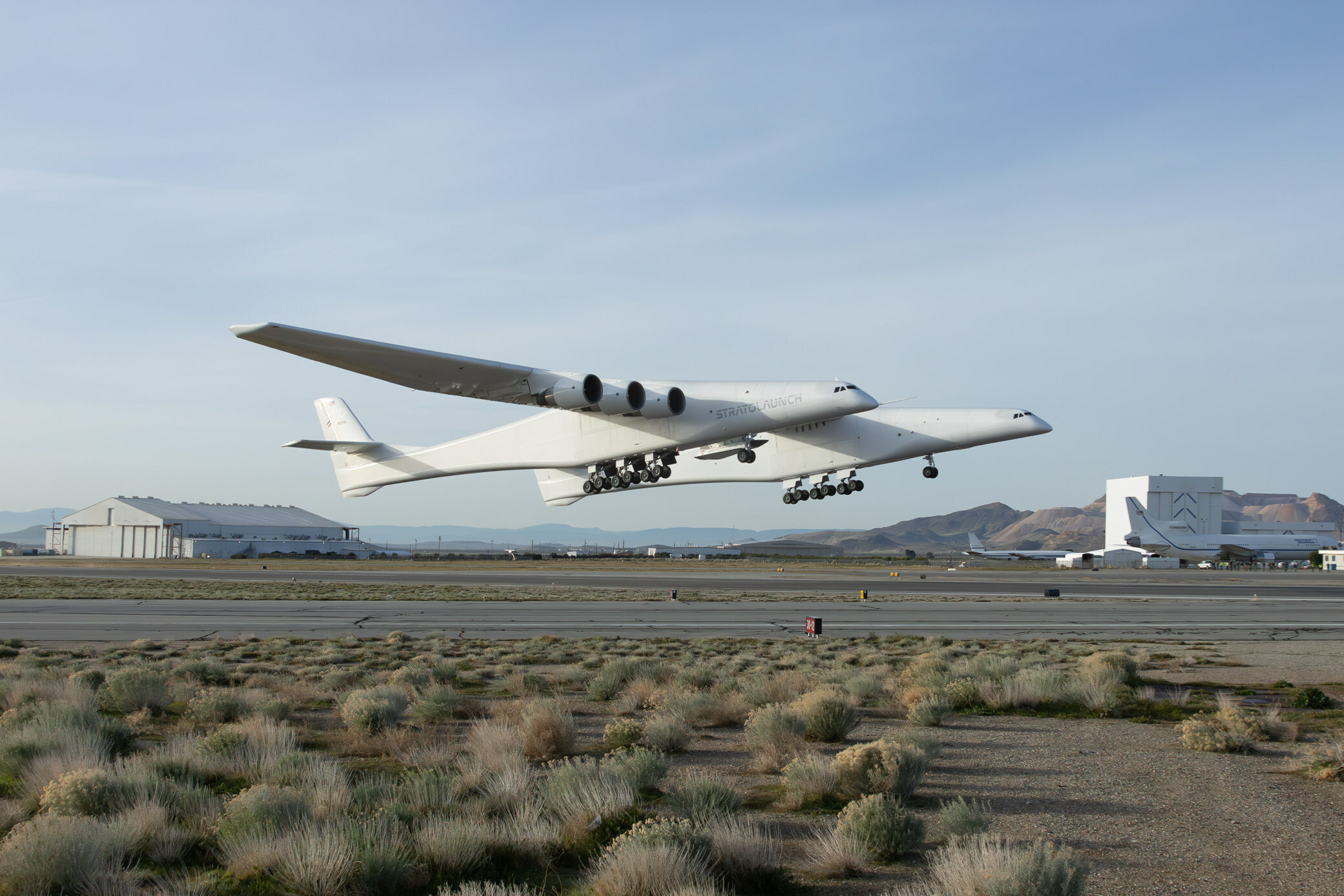 On its 14th test flight, Stratolaunch's Roc air launch platform takes off from Mojave Air and Space Port at Rutan Field on March 9, 2024, with the Talon vehicle on its center-wing pylon.