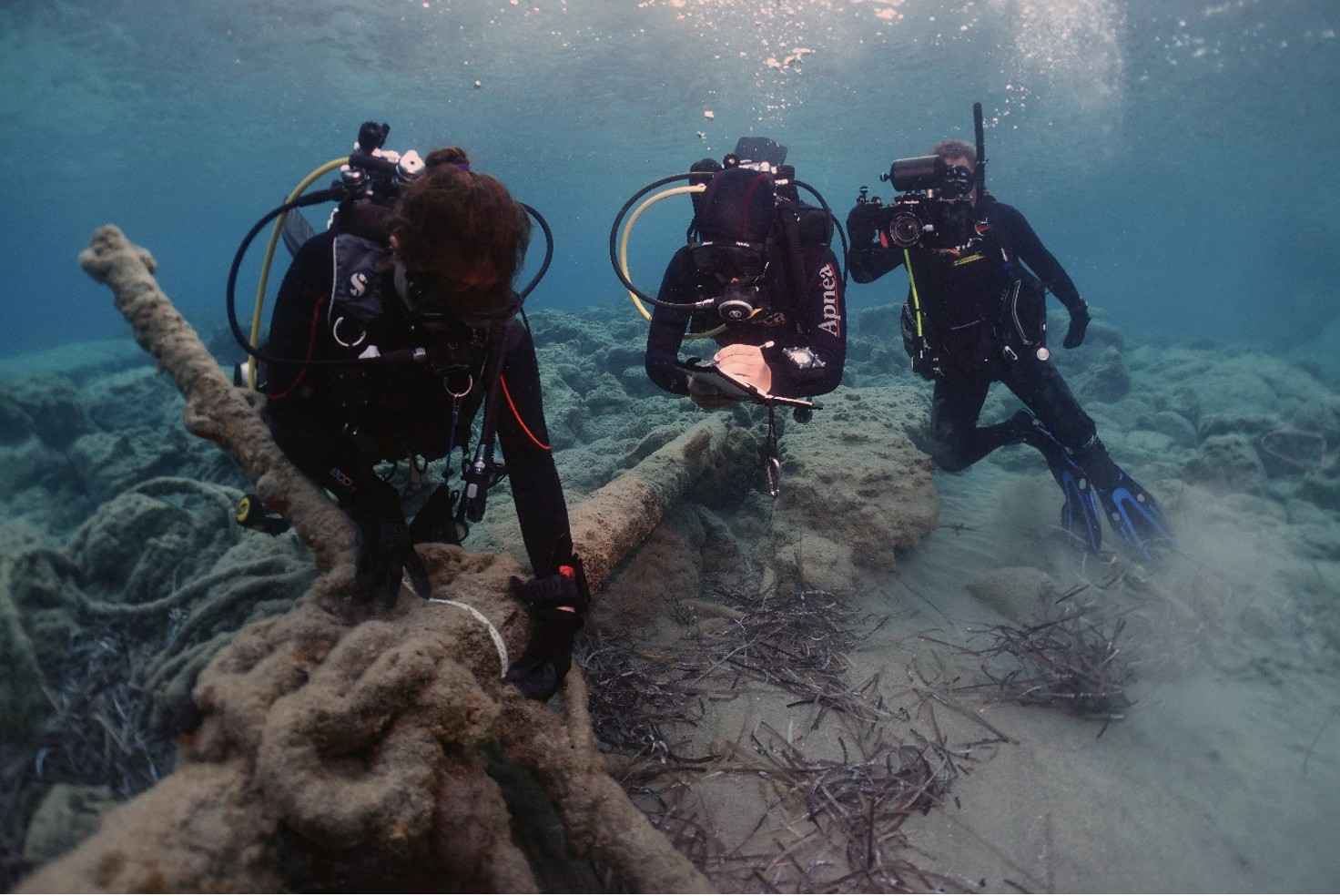 Divers exploring a shipwreck