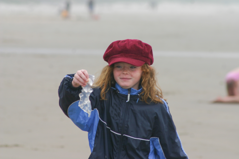 a child holding gelatinous ocean creature similar in texture to oakville blobs