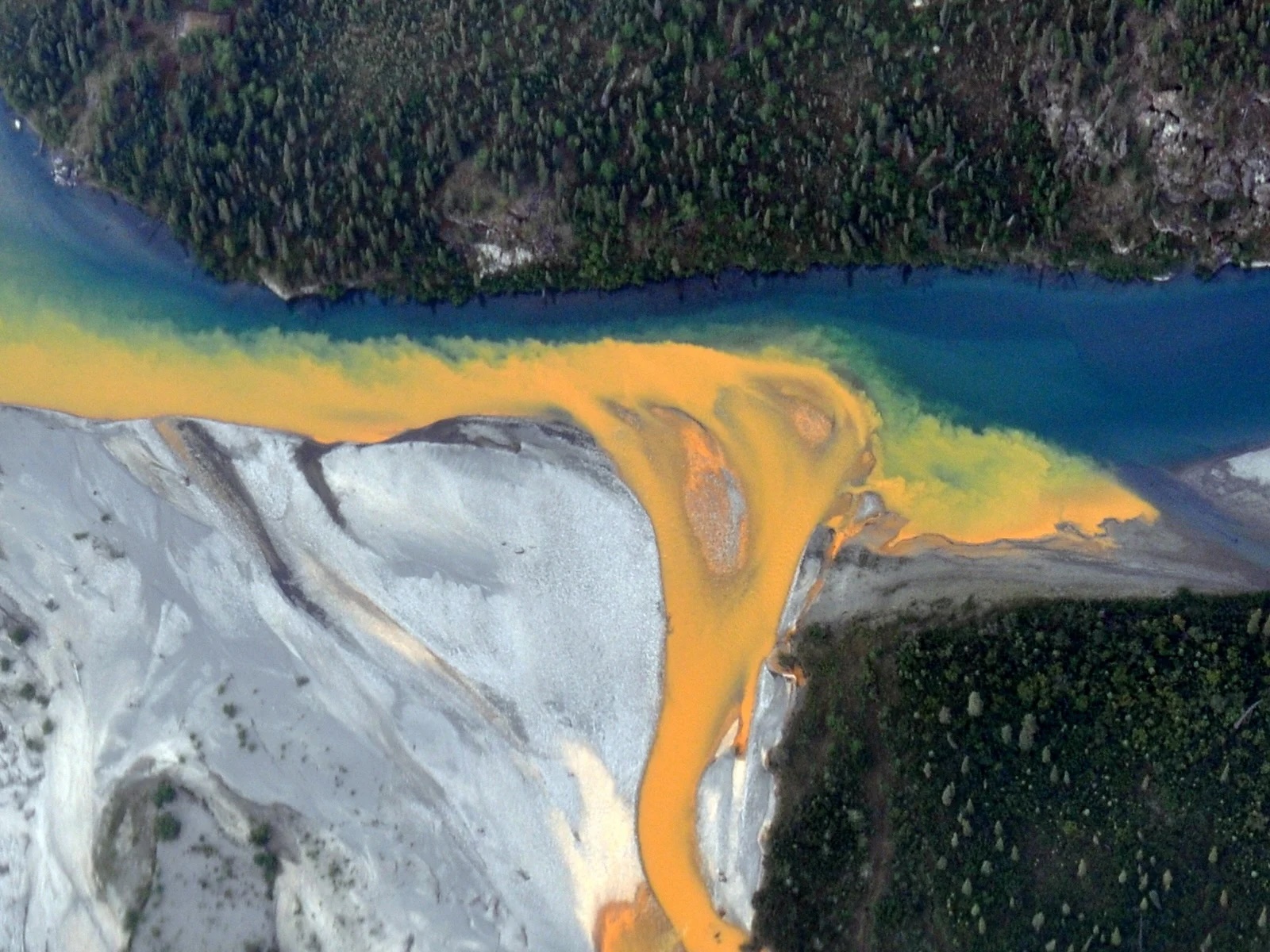 Aerial view of the orange waters at the Kutuk River in Alaska's Gates of the Arctic National Park.