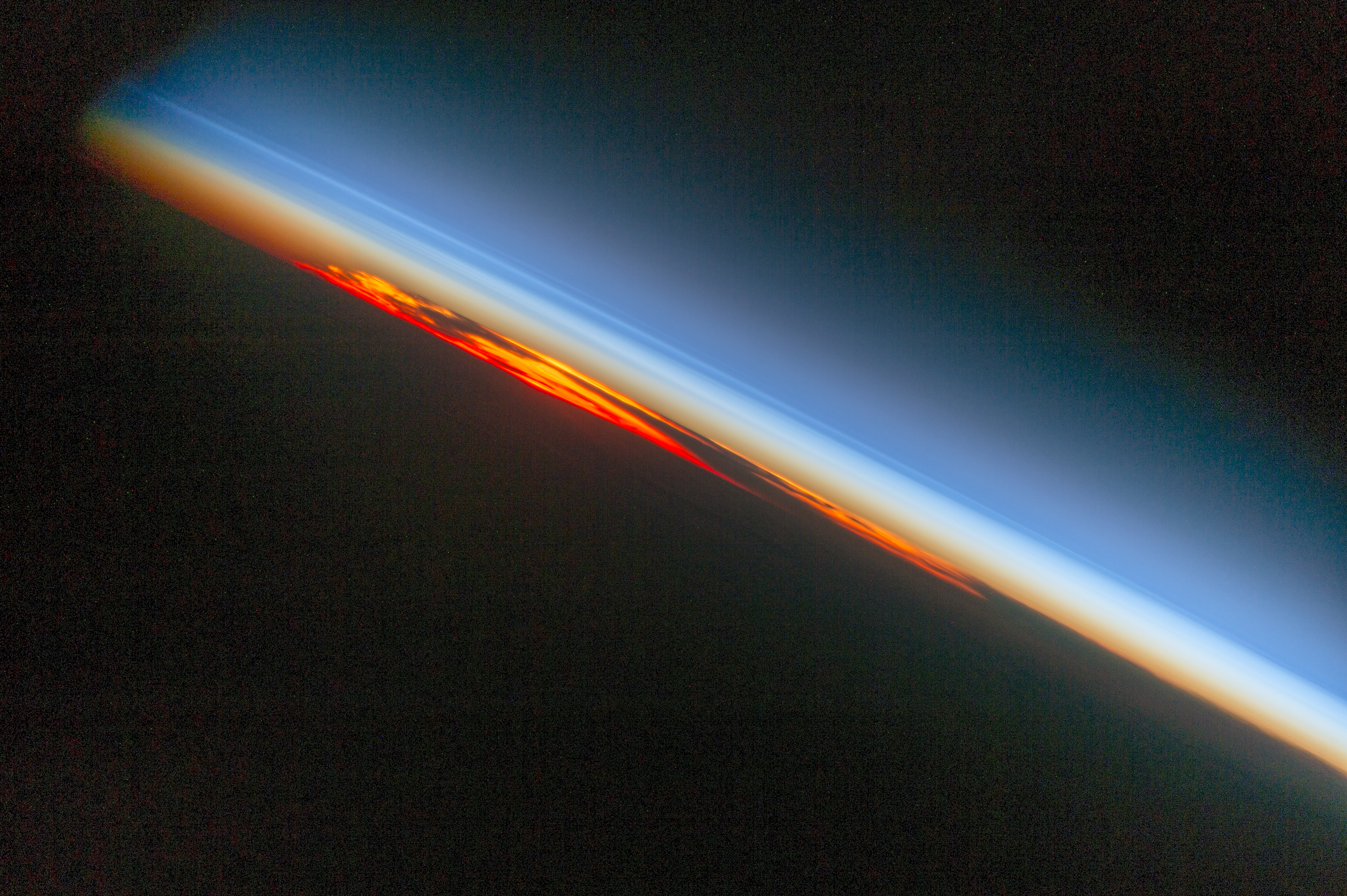 sideways view of a sunset taken by crew on the international space station