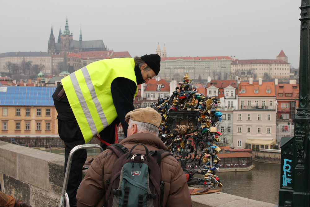 love locks being removed from a bridge in prague