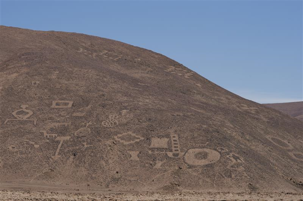 atacama geoglyphs on the dusty hillside, lots of abstract shapes