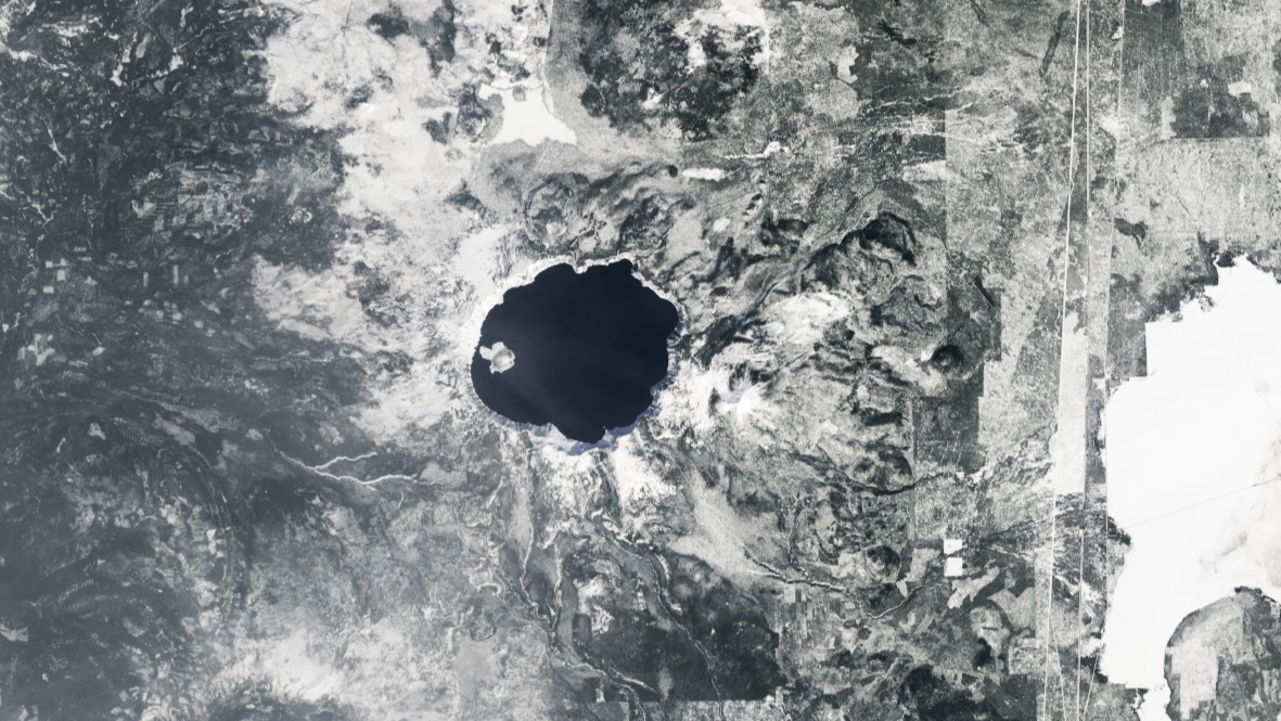 A satellite image of Crater Lake taken by Landsat-8 on March 18, 2023.