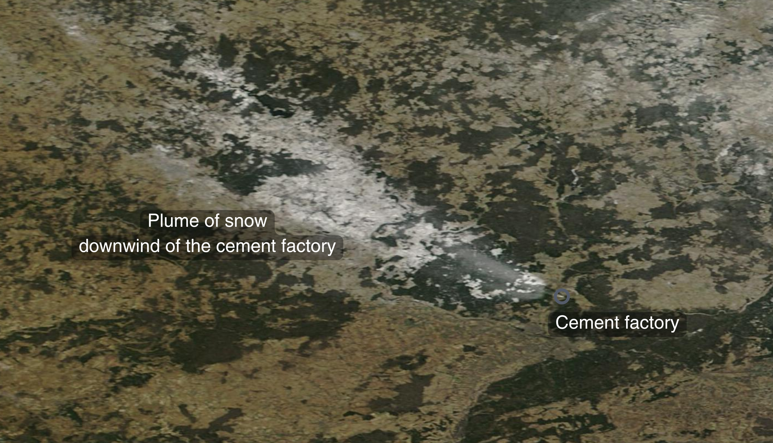 The satellite image shows a plume of snow on the ground downwind of the Fokino cement plant in Russia.