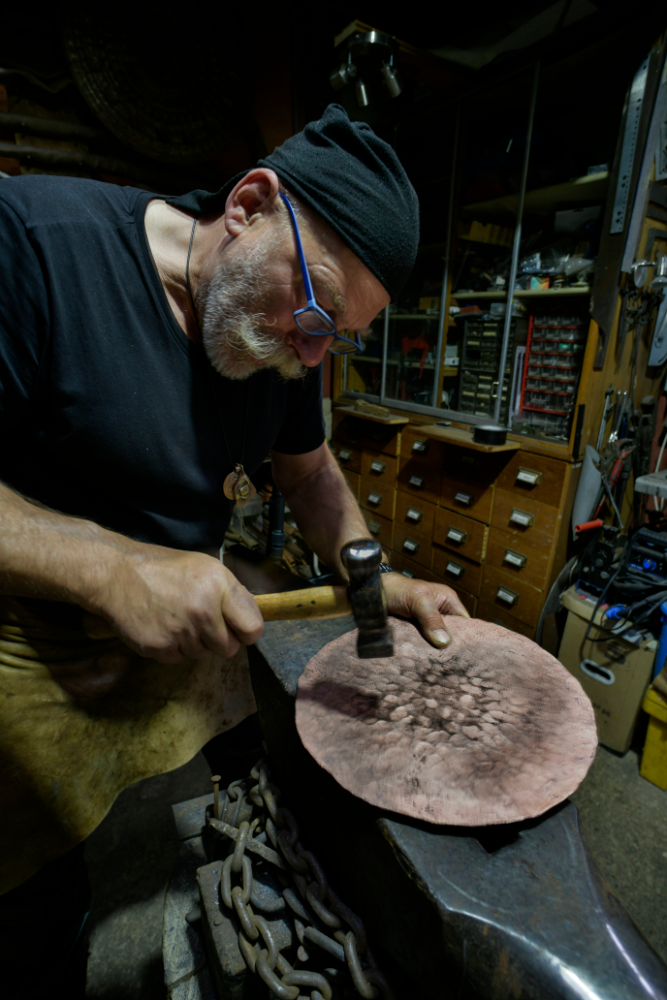 Coppersmith Herbert Bauer in the process of replicating the Nubra Sky Disc, although we also want to know how he managed that moustache.