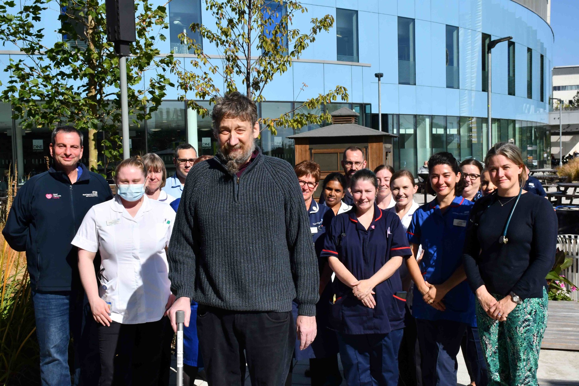 Patient Daniel Evans-Smith pictured in September 2024 with some of the NHS staff who were caring for him.