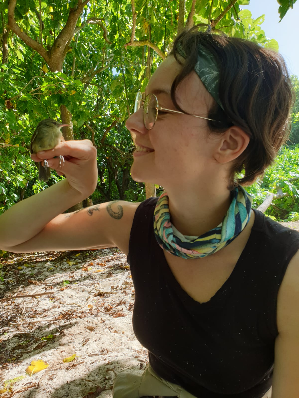 Frigg Speelman looking lovingly at a warbler