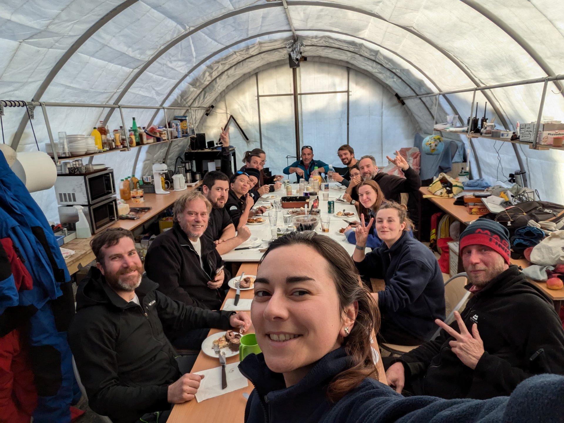 Scientists on the Old Ice project in Antartica have dinner in November 2024.