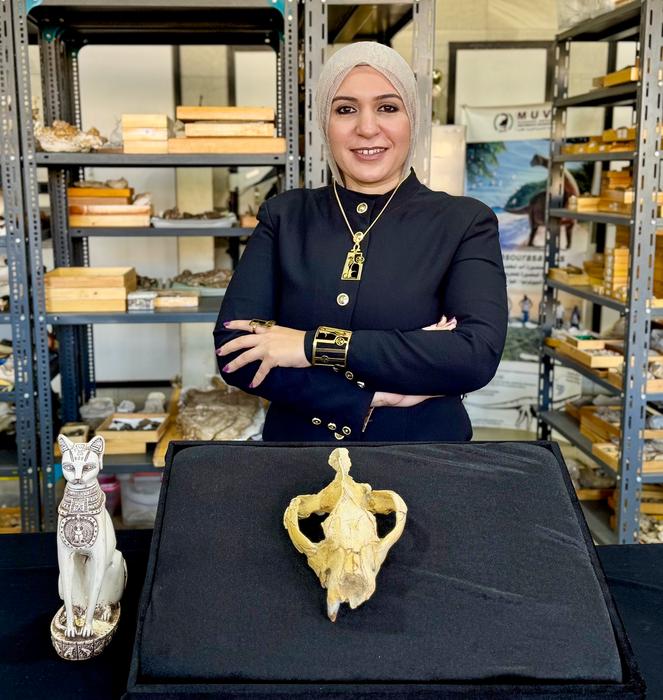 Shorouq Al-Ashqar and the Bastetodon skull whose scientific description she was first author on.