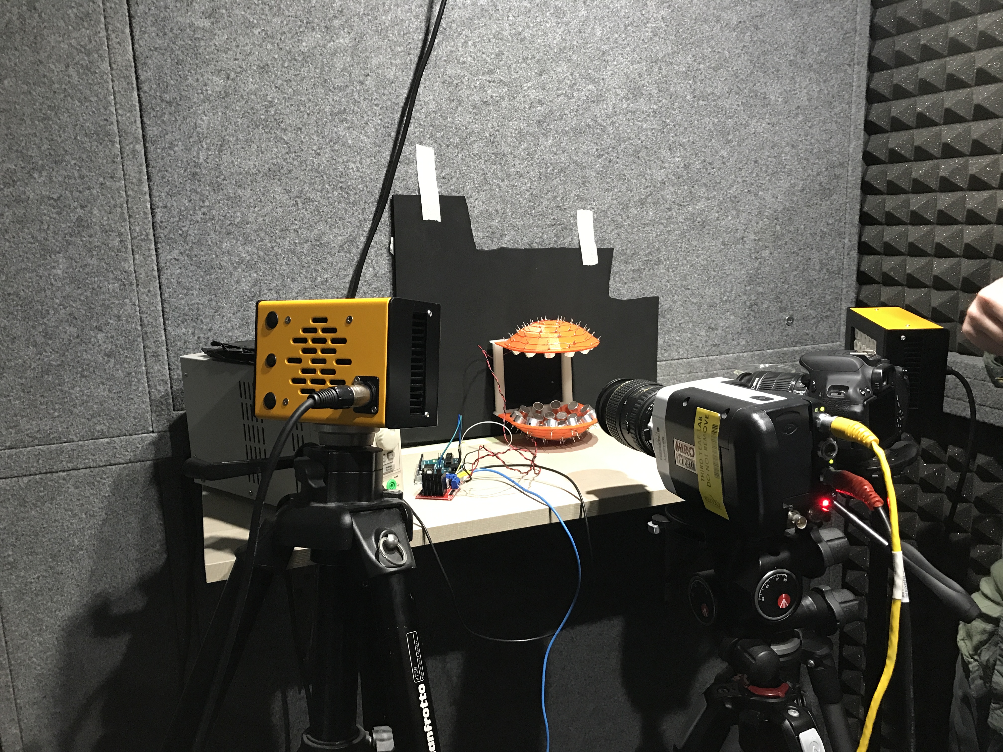 The student bubble-makers' elaborate set-up, including an acoustic levitator at the center and a camera looking at it.