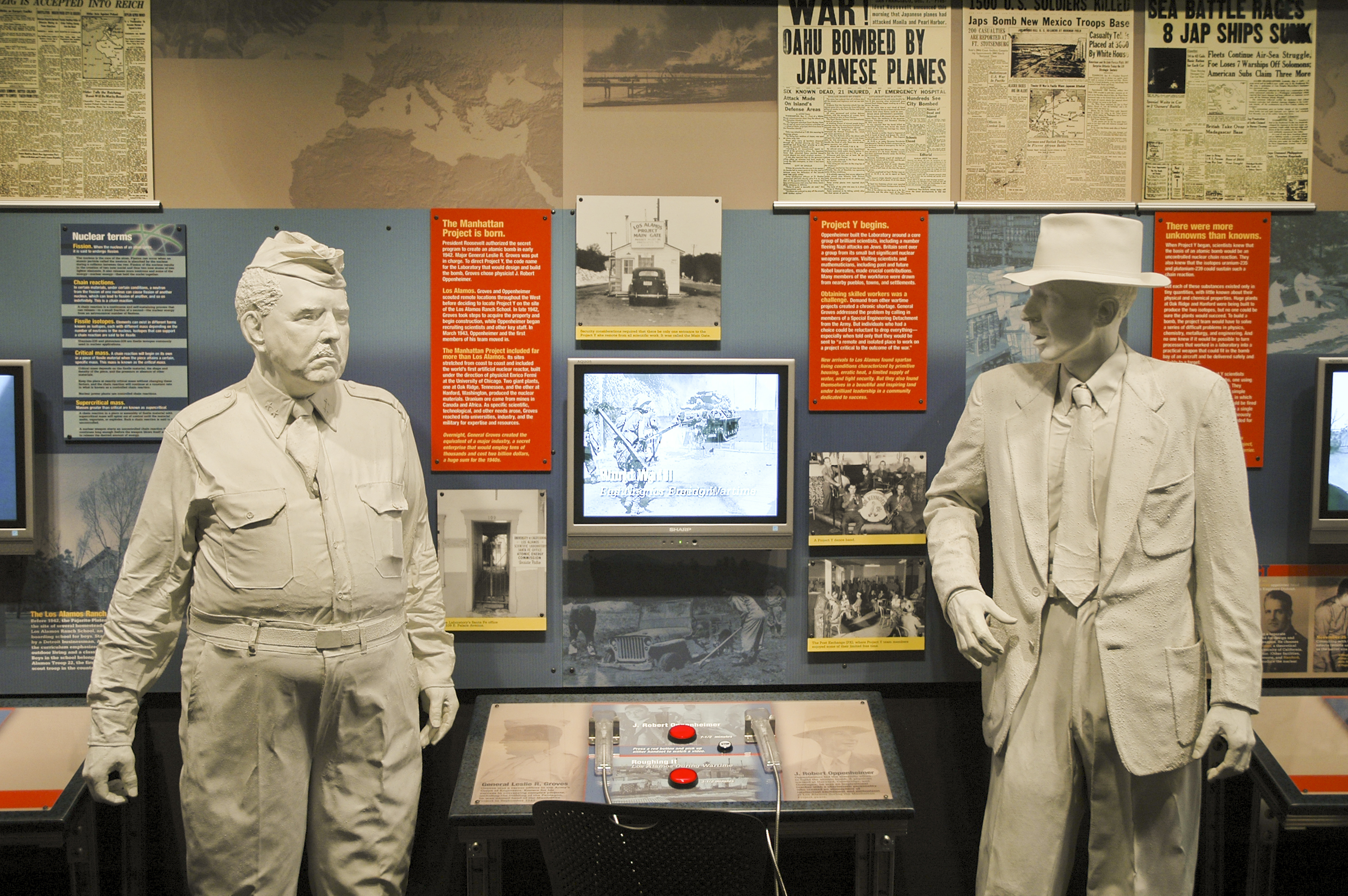 J. Robert Oppenheimer, the first director of Los Alamos National Laboratory, is depicted in the model on the left, alongside Leslie Groves. 