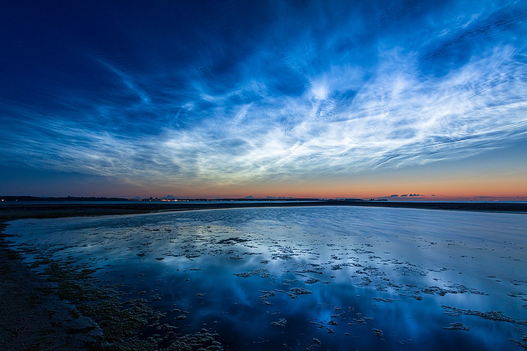 Blue and silvery noctilucent clouds in Laboe on the coast of Germany. Blue and silvery noctilucent clouds in Laboe on the coast of Germany.
