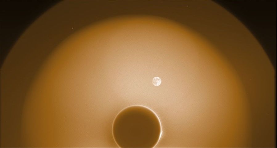 During commissioning, PUNCH’s NFI instrument captured this image of the new Moon as it passed by the Sun in the sky on April 27, 2025. The new Moon appears full, because it is illuminated by Earthshine (sunlight reflected off Earth). The image helped the PUNCH team confirm that the Moon will not obscure NFI’s view of the corona and solar wind. The dark circle near the bottom is the shadow of NFI’s occulter, which hides the Sun. The occulter, which was not yet fully aligned with the Sun, is surrounded by a narrow bright ring of diffracted light. Around that is a large, hazy circle of stray light glinting off the occulter (the Moon is inside that circle). Outside that is a small, dimmer region of the sky that is less affected by glint. During commissioning, PUNCH’s NFI instrument captured this image of the new Moon as it passed by the Sun in the sky on April 27, 2025. The new Moon appears full, because it is illuminated by Earthshine (sunlight reflected off Earth). The image helped the PUNCH team confirm that the Moon will not obscure NFI’s view of the corona and solar wind. The dark circle near the bottom is the shadow of NFI’s occulter, which hides the Sun. The occulter, which was not yet fully aligned with the Sun, is surrounded by a narrow bright ring of diffracted light. Around that is a large, hazy circle of stray light glinting off the occulter (the Moon is inside that circle). Outside that is a small, dimmer region of the sky that is less affected by glint.