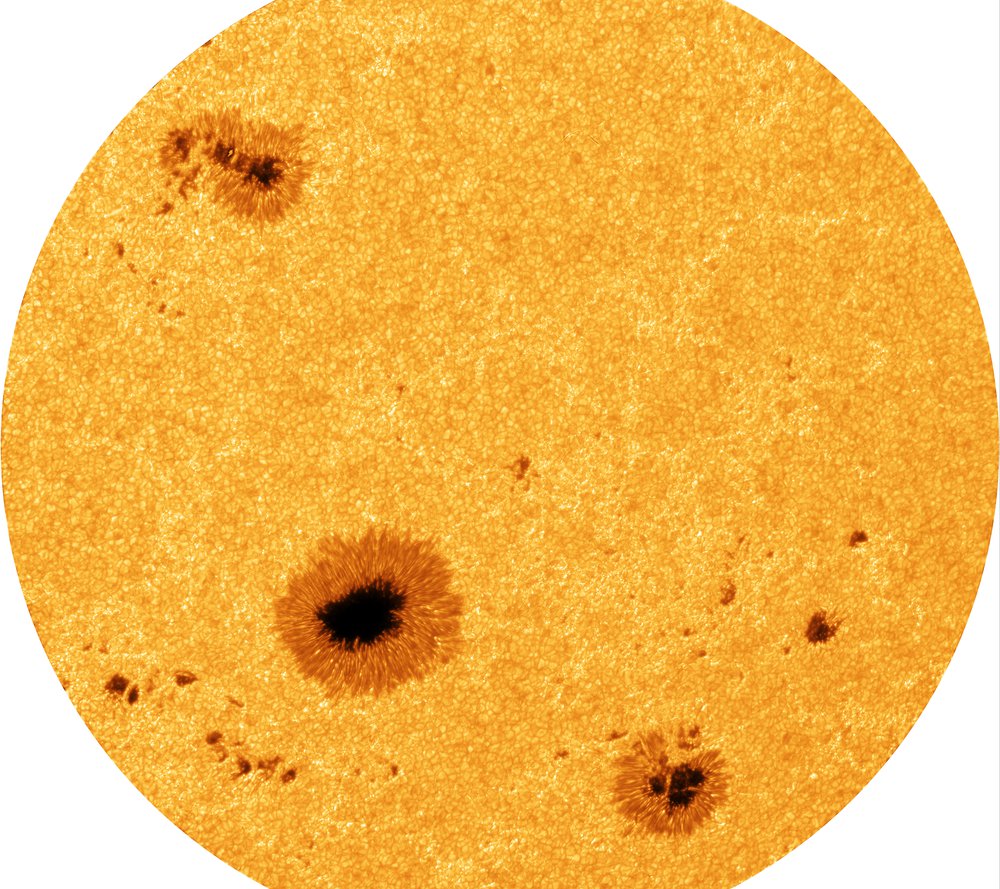the image shows muliple sunspots and the grainy nature of the photosphere. the image shows muliple sunspots and the grainy nature of the photosphere.