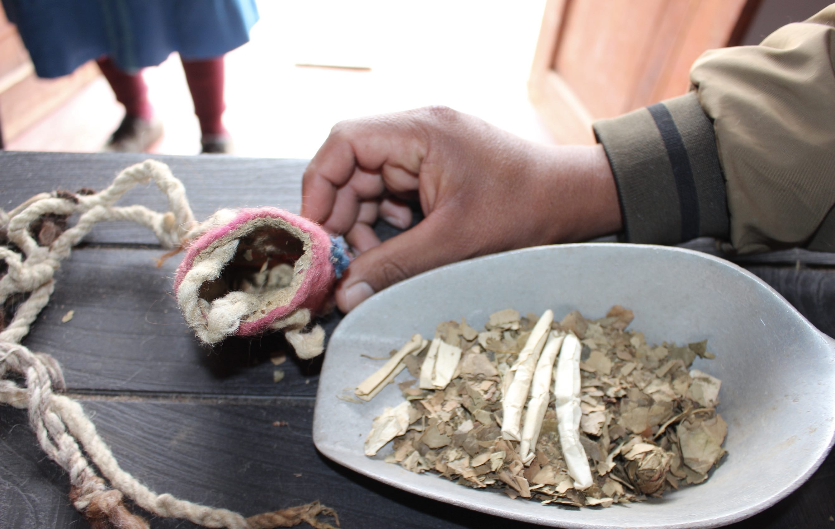 Coca leaves and cigarettes attached to an Inca khipu Coca leaves and cigarettes attached to an Inca khipu
