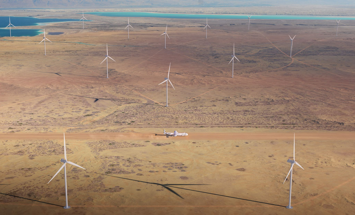 windrunner giant aircraft landing in a desert surrounded by wind turbines windrunner giant aircraft landing in a desert surrounded by wind turbines