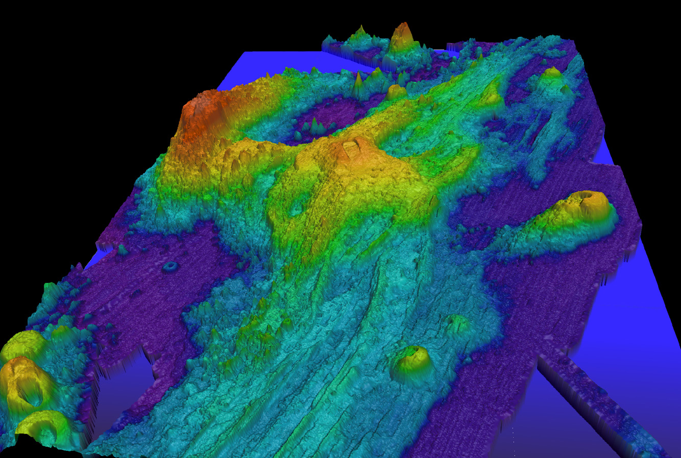 Exaggerated swatch bathymetry of Axial Seamount on the Juan de Fuca Ridge, approximately 480 km (298 mi) west of Cannon Beach, Oregon. Exaggerated swatch bathymetry of Axial Seamount on the Juan de Fuca Ridge, approximately 480 km (298 mi) west of Cannon Beach, Oregon.