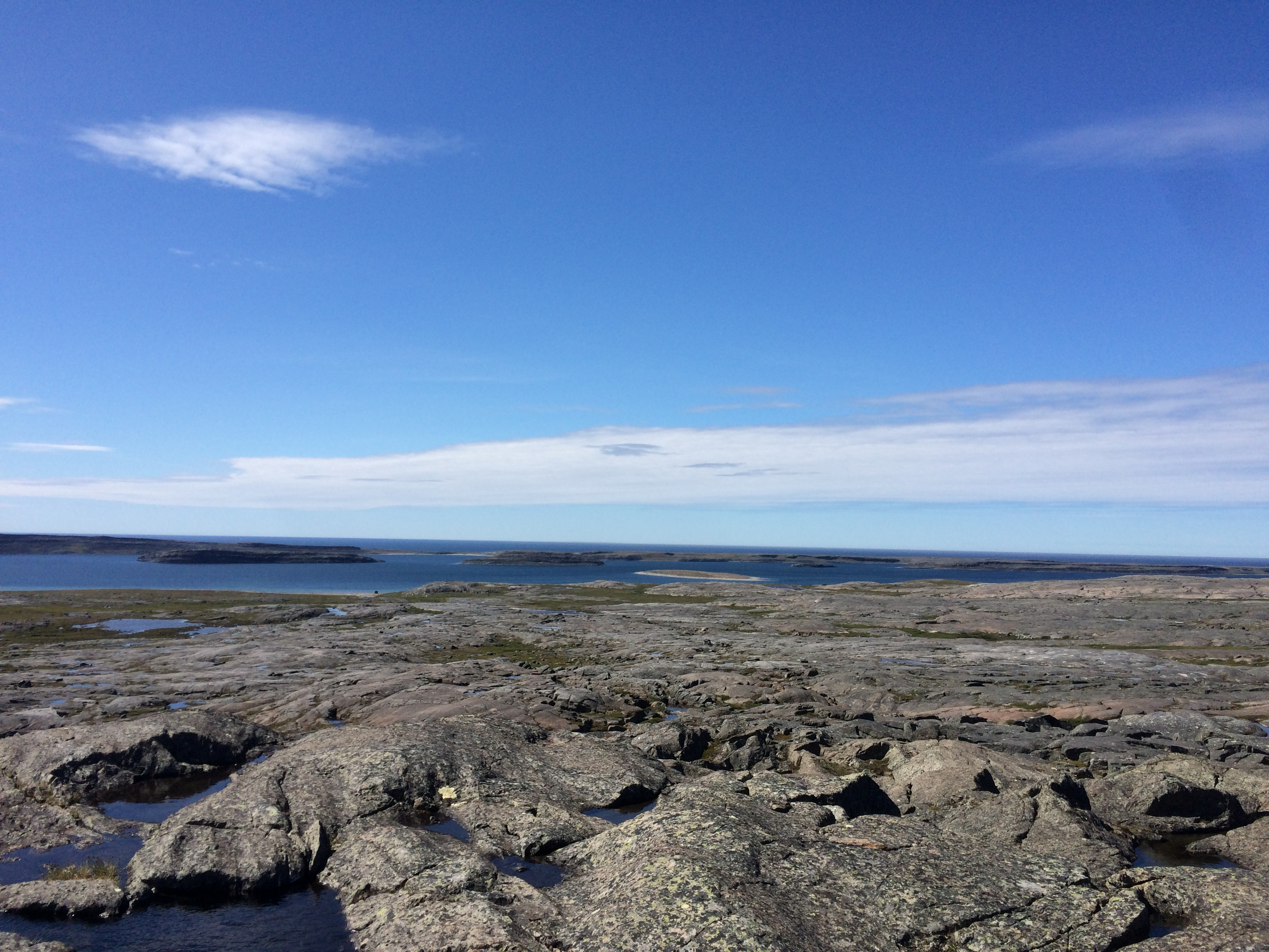 View from the Nuvvuagittuq greenstone belt, Nunavik, Quebec, Canada, looking out onto Hudson Bay on a sunny day View from the Nuvvuagittuq greenstone belt, Nunavik, Quebec, Canada, looking out onto Hudson Bay on a sunny day