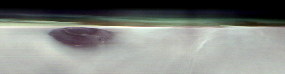 Arsia Mons volcano peering through the clouds. Arsia Mons volcano peering through the clouds.