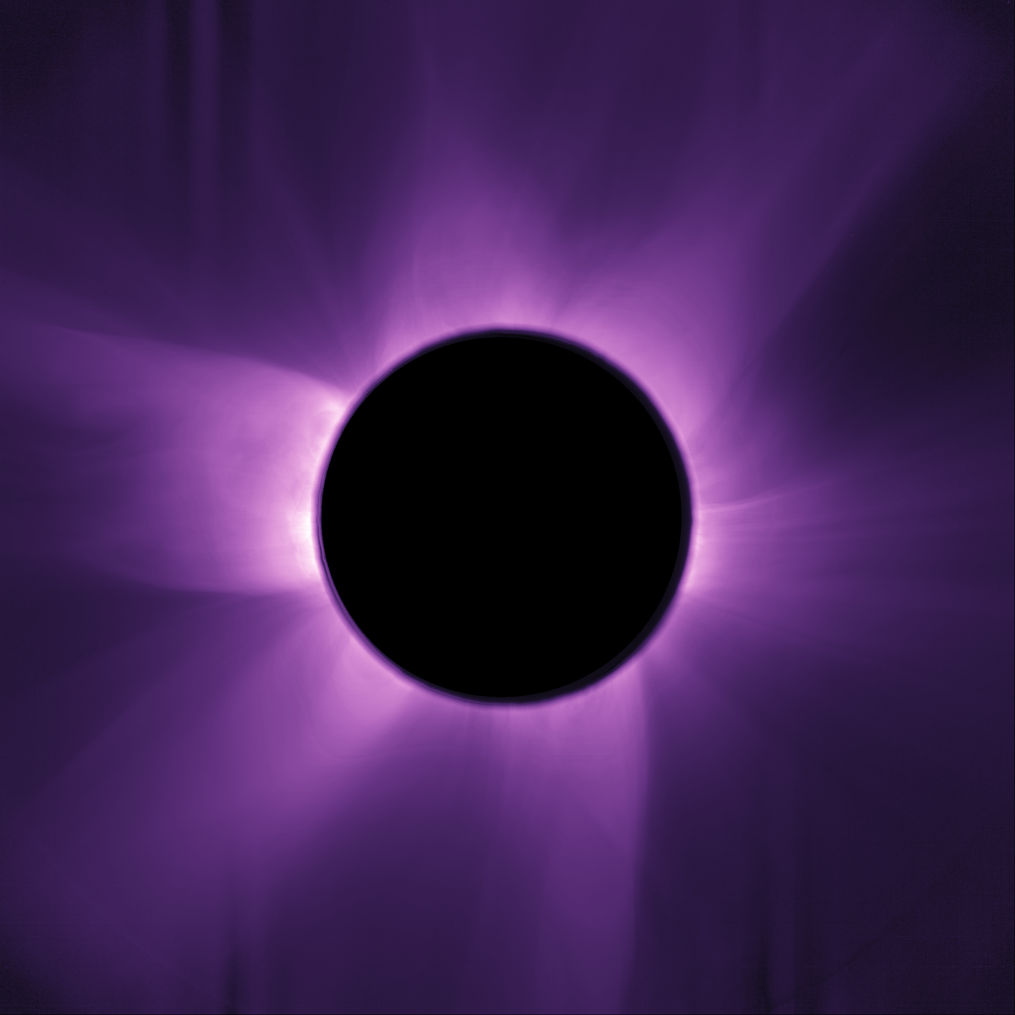 Wispy structure emerged from behidn a a black disk Wispy structure emerged from behidn a a black disk