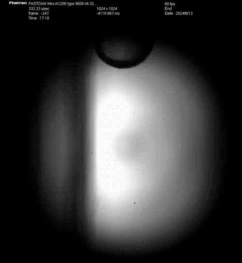 A ball rolls down a surface vertically. A ball rolls down a surface vertically.