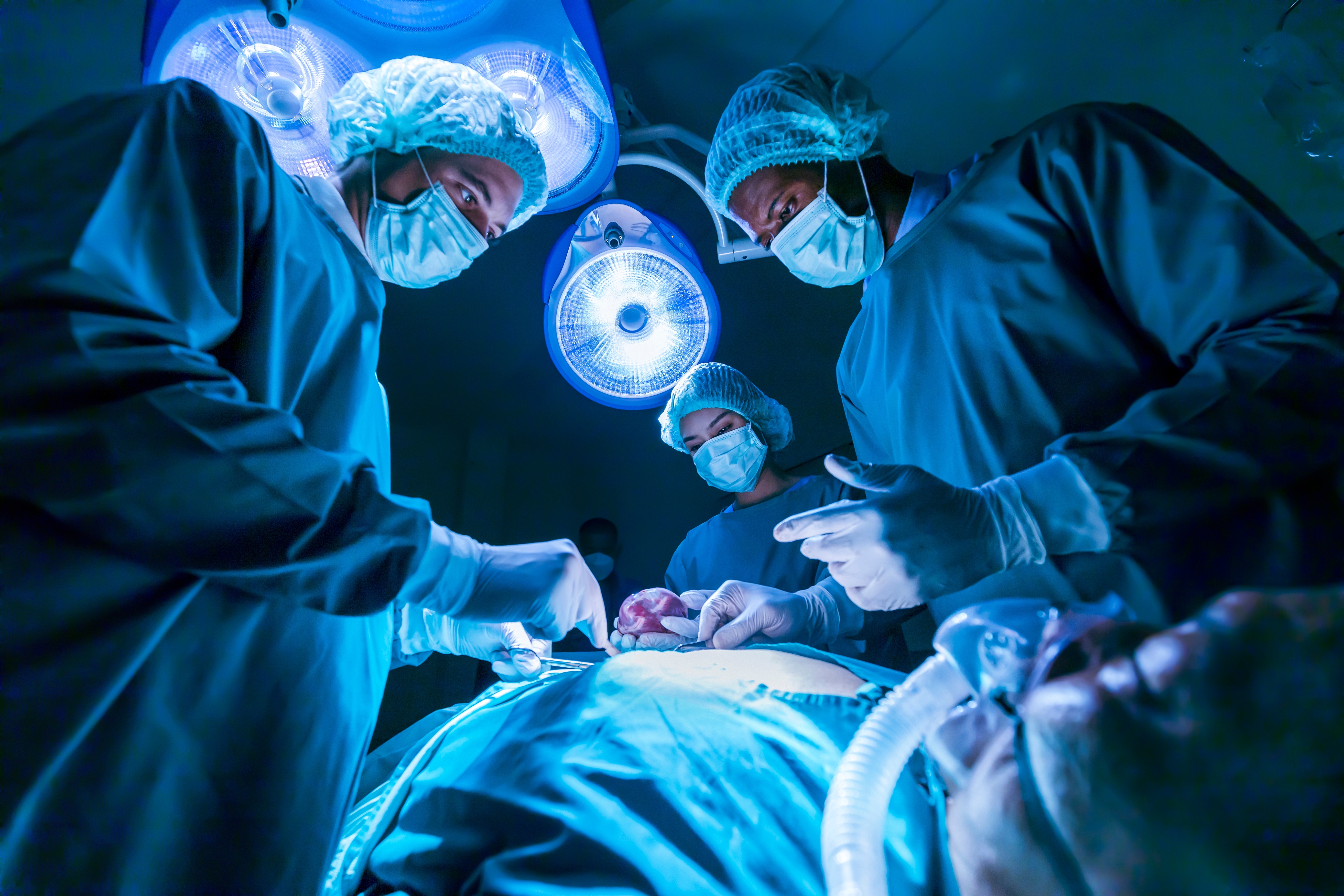 Surgeons operating on patient Surgeons operating on patient